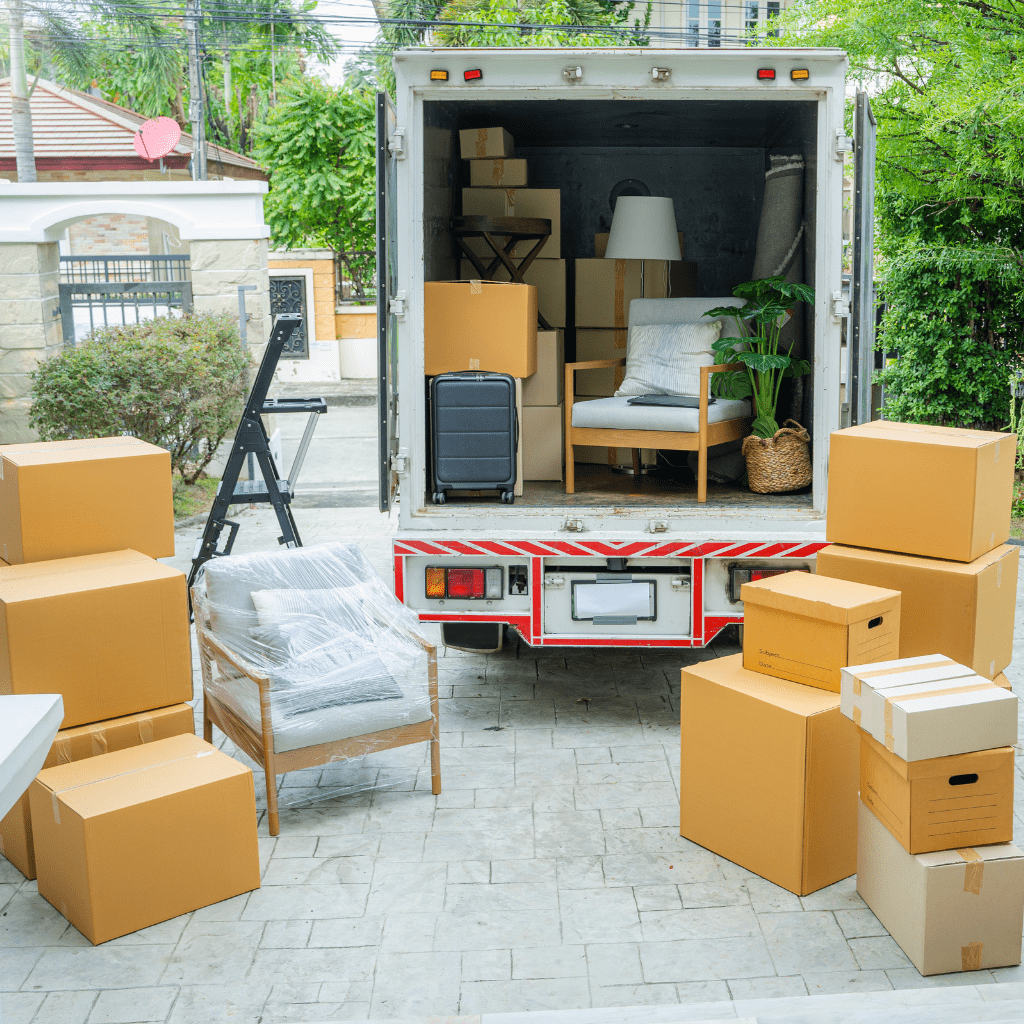 a moving truck with boxes and furniture