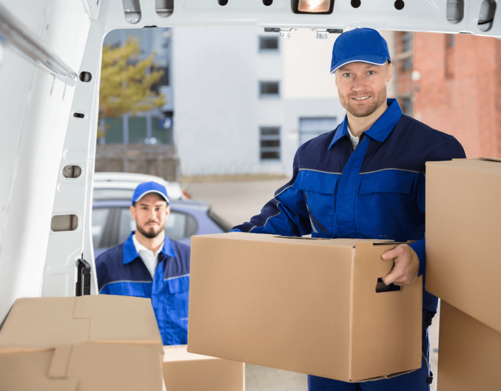 a group of men carrying boxes